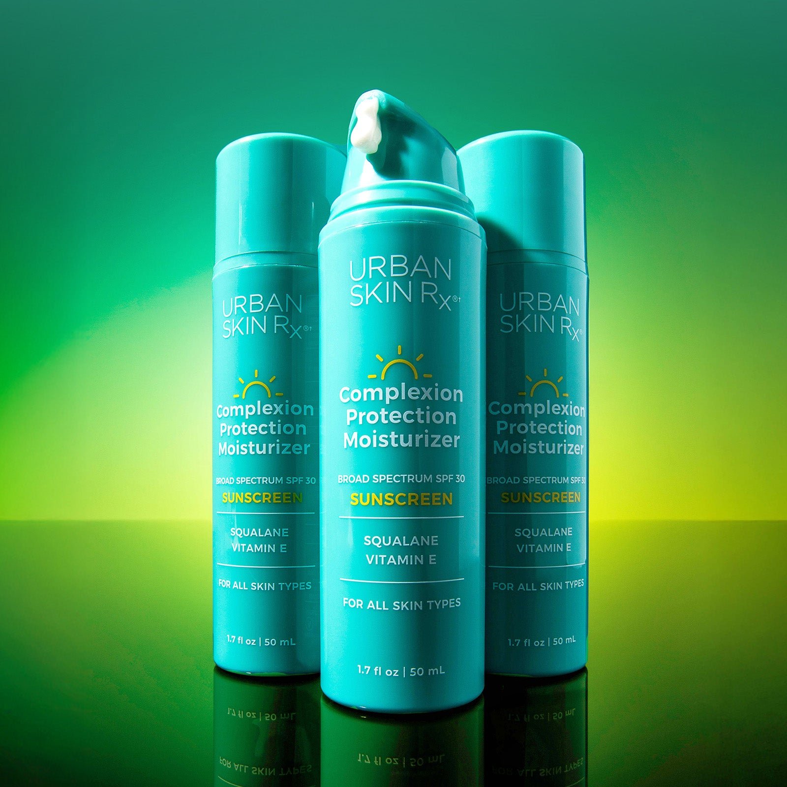 Three bottles of USRx Complexion Protection SPF30 Moisturizer on a bright green background