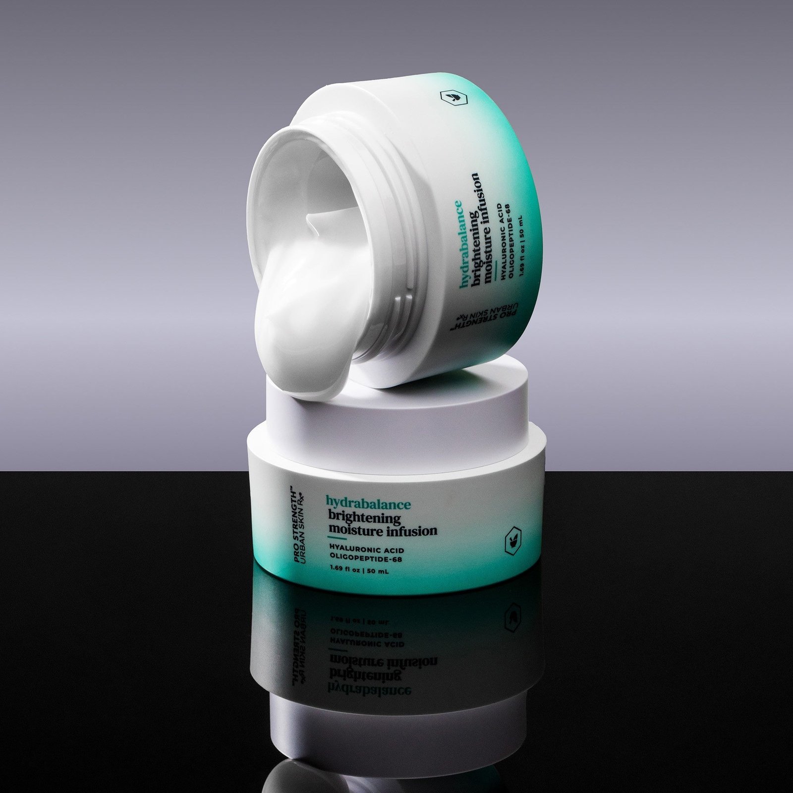 Two jars of USRx Hydrabalance Moisturizer against a neutral background